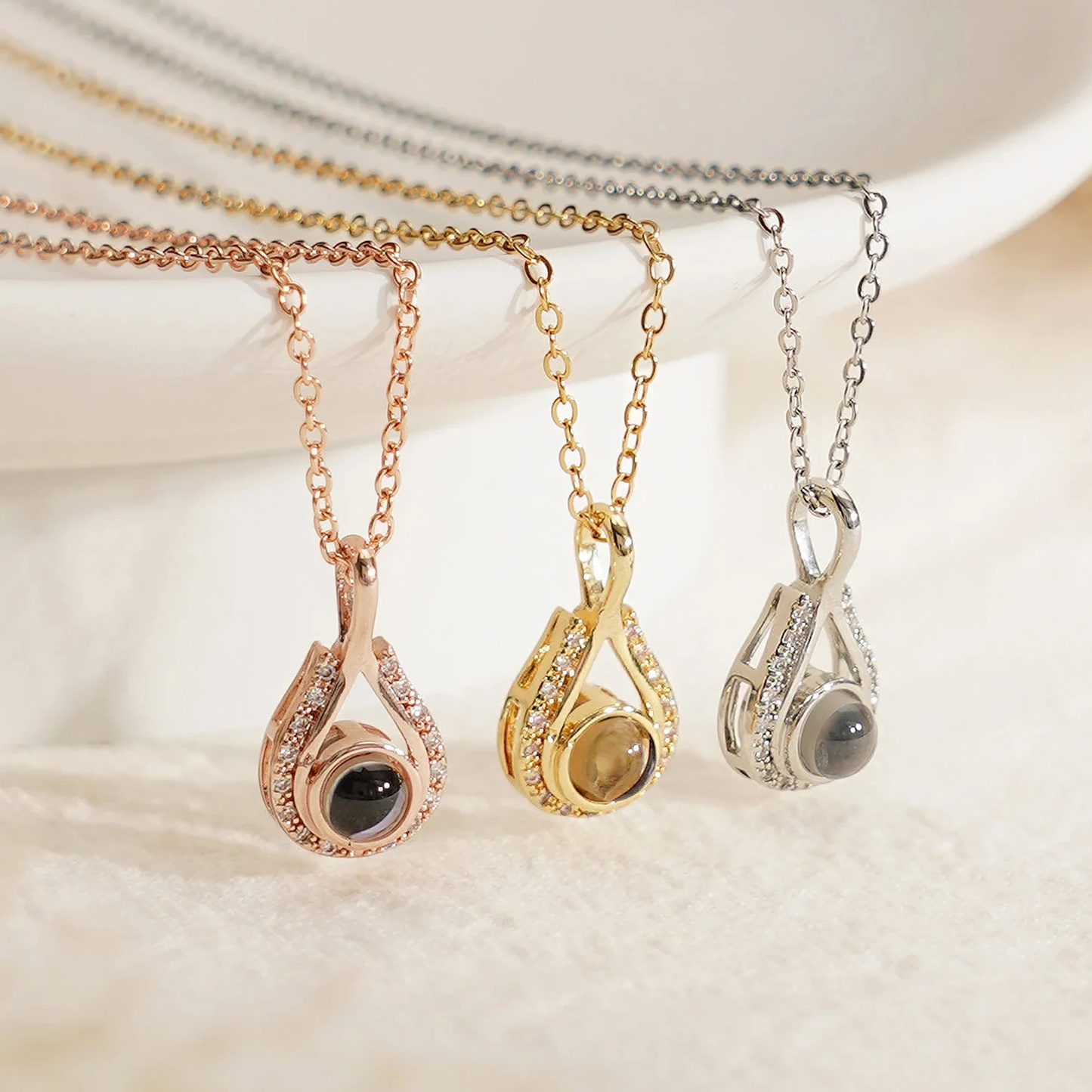 LevNSoul memorial photo projection necklace in gold, rose gold, and silver tones