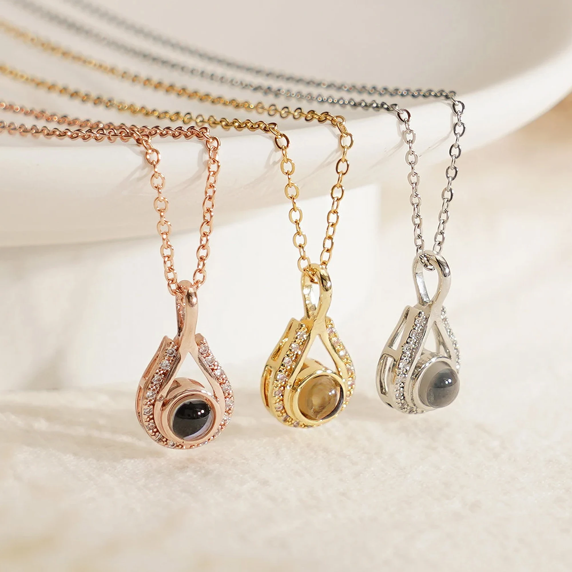 LevNSoul memorial photo projection necklace in gold, rose gold, and silver tones