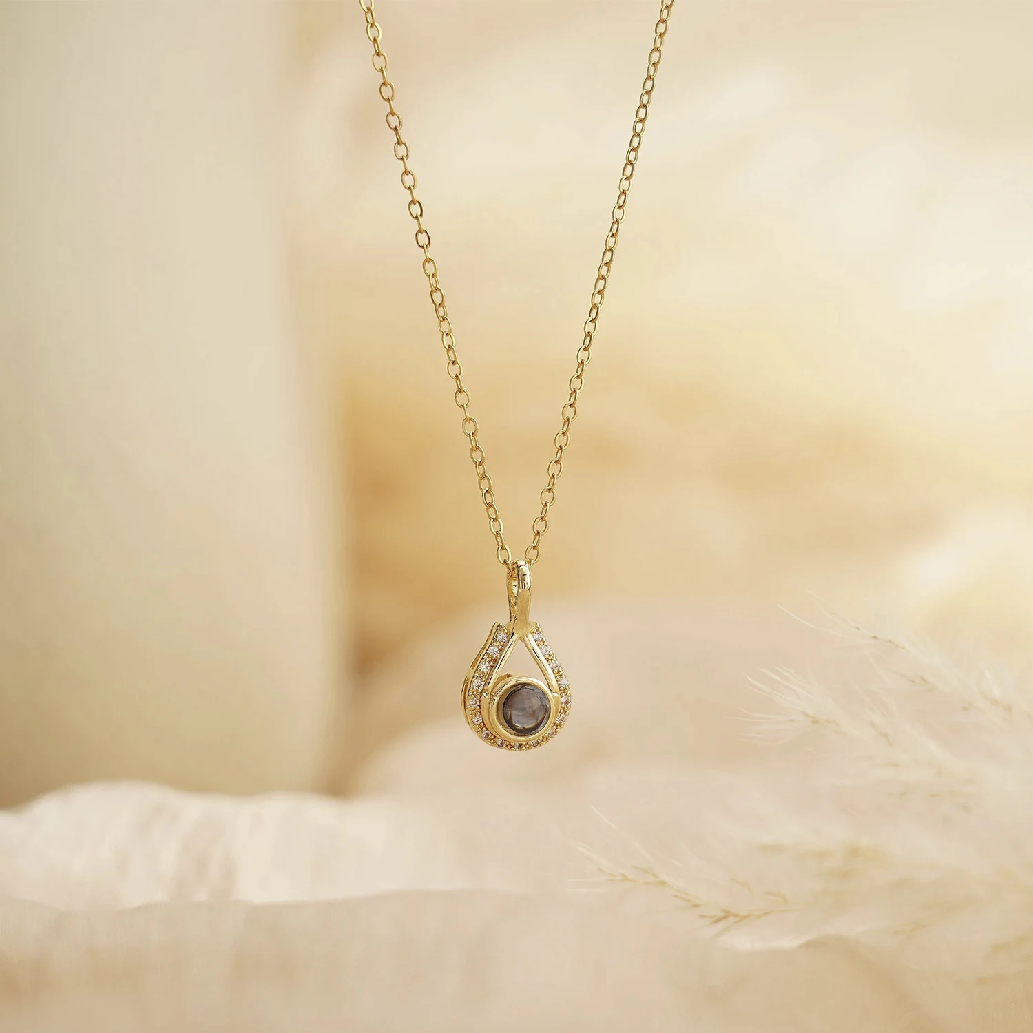 LevNSoul gold-tone memorial photo projection necklace, pendant detail